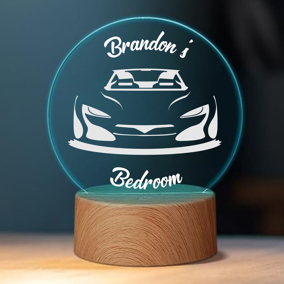 Kids night light laser engraved with their name and an image of a car.