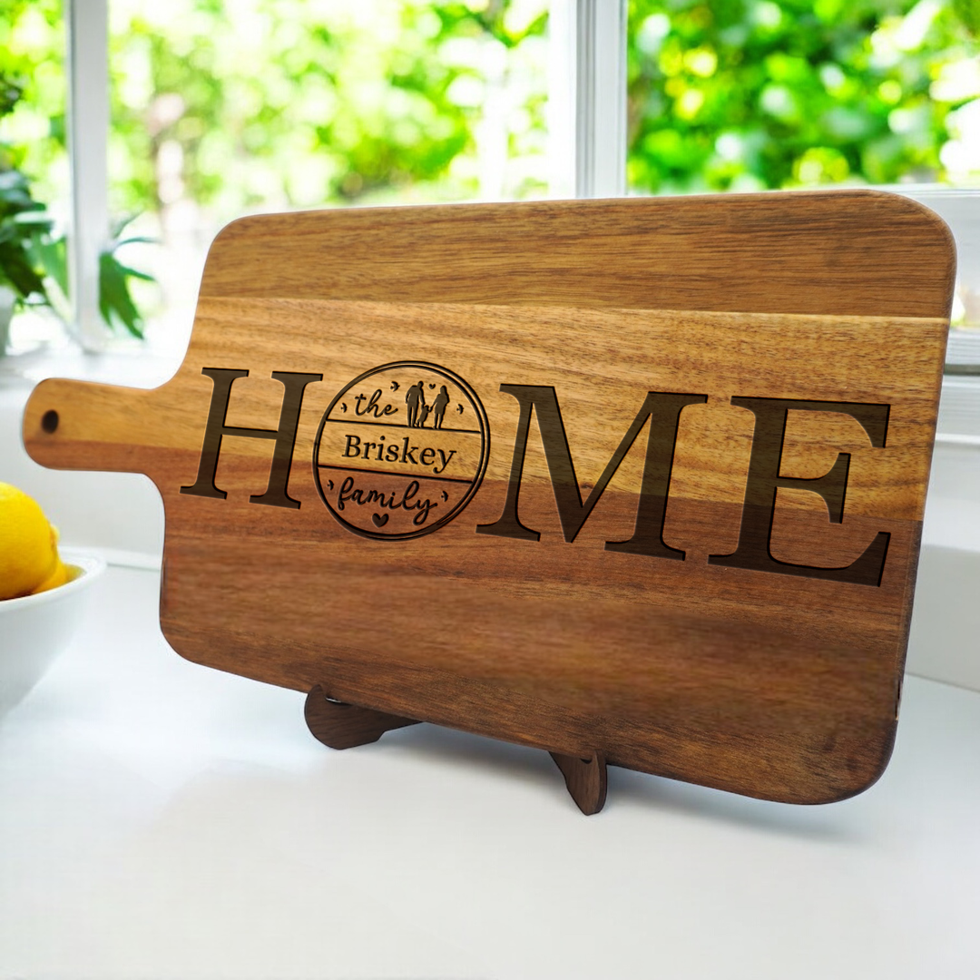 Personalized cutting board with handle for housewarming gifts.