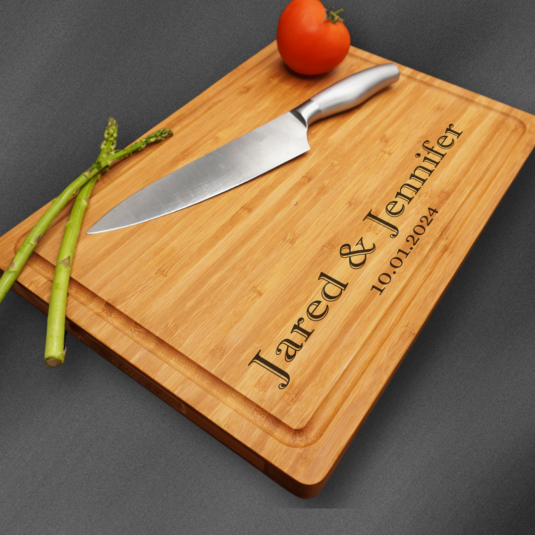 Large personalized cutting board engraved at the base with a couples name.