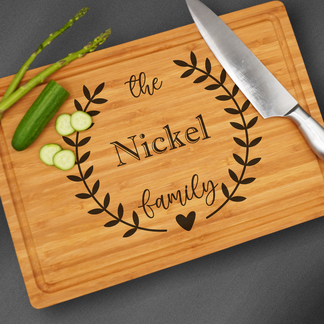 Large Cutting board that is laser engraved with a design and a family name.