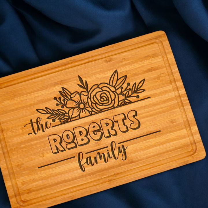 Personalized cutting board with handle and family engraving for anniversaries. 