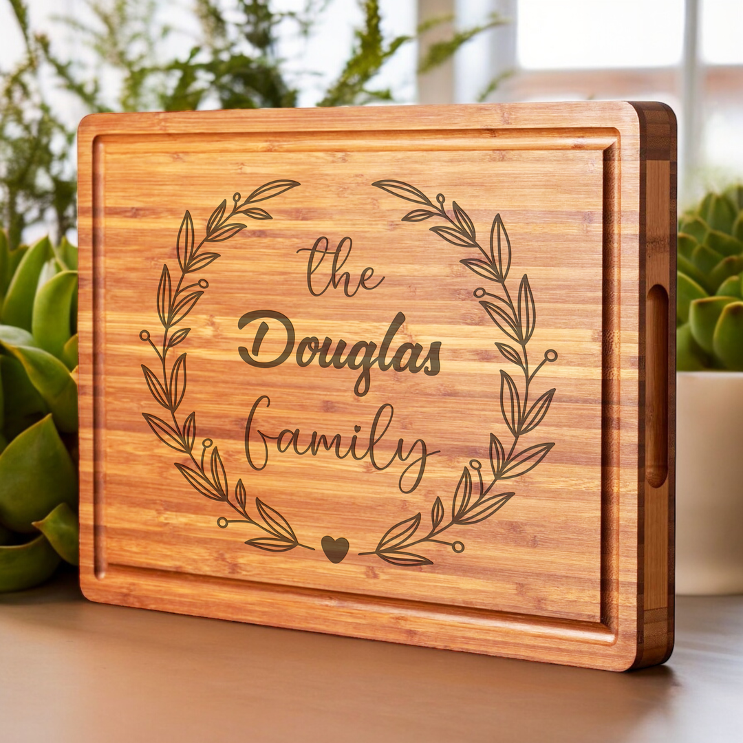 Personalized cutting board with handle and family engraving for anniversary gifts.