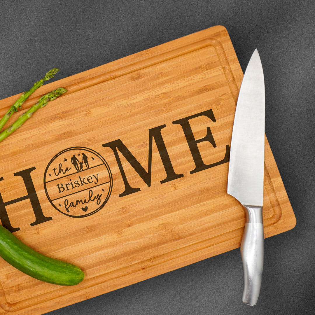 large custom personalized wooden cutting board engraved with a family name.