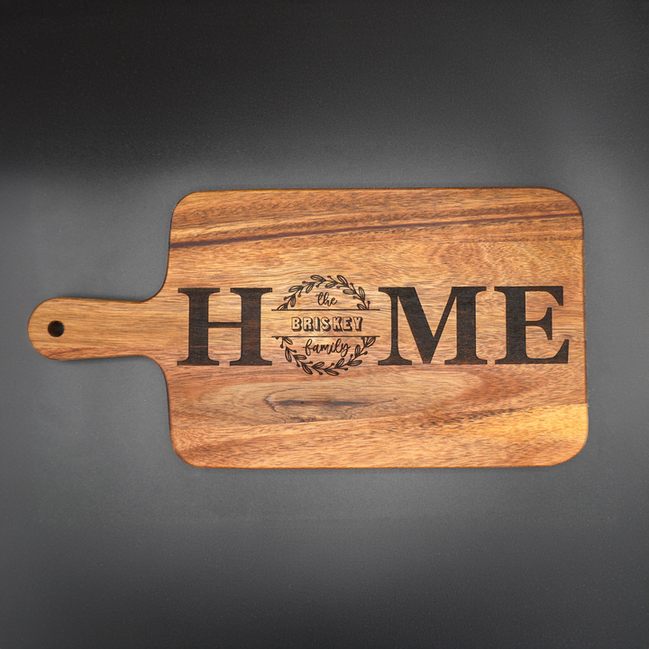 Personalized cutting board with handle and laser engraving.