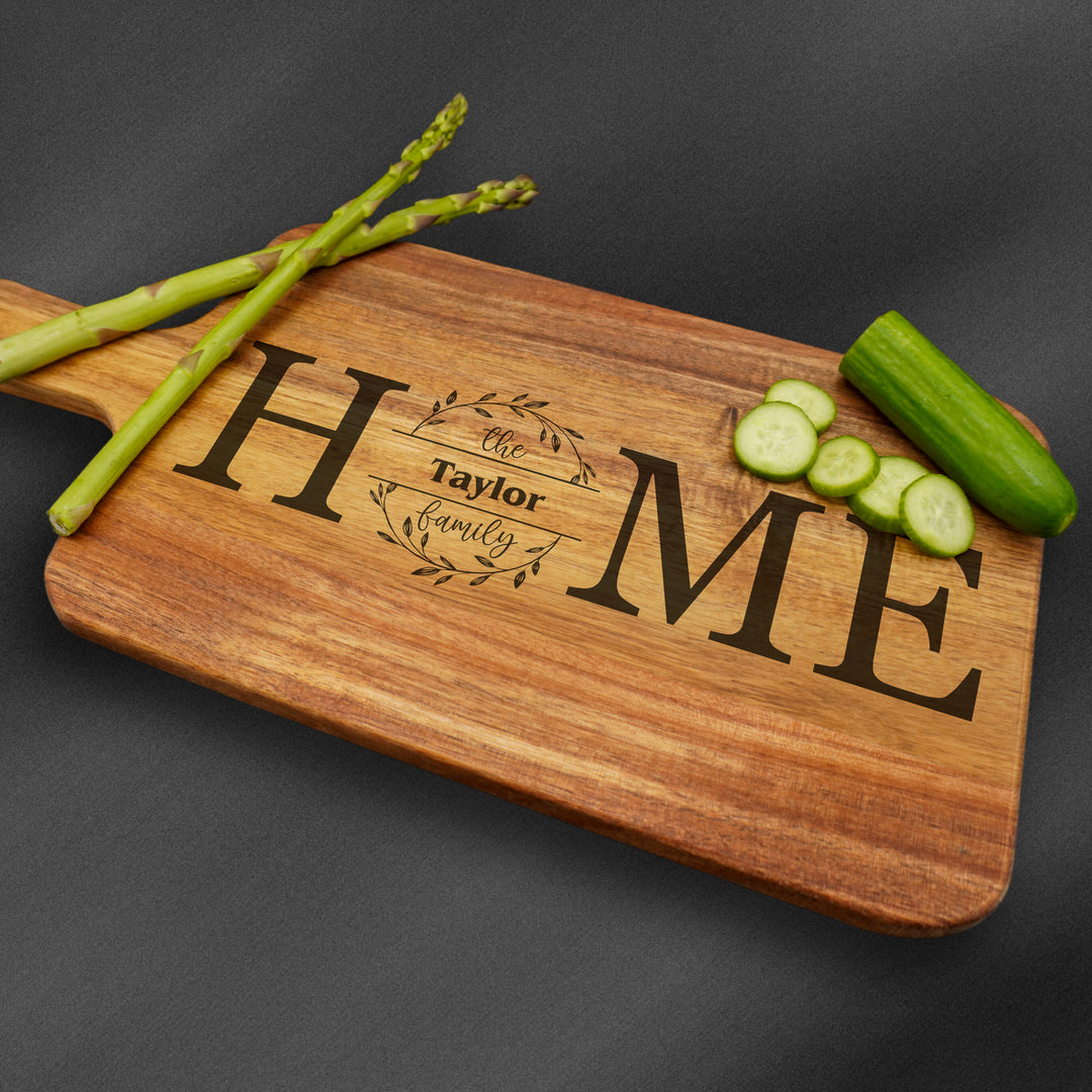 Custom personalzied wooden cutting board engraved with a family name.