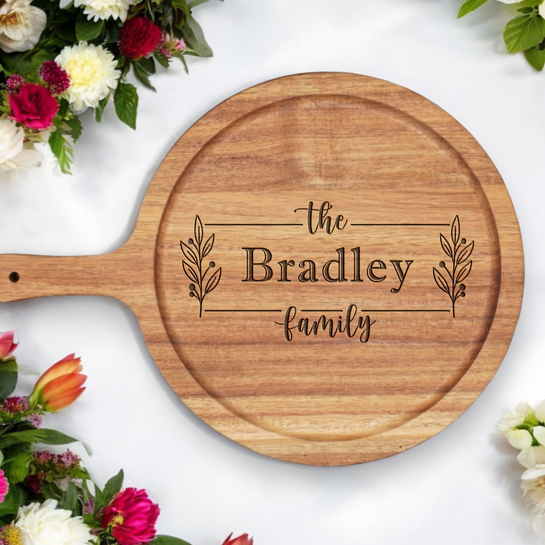 Personalized serving tray with handle and family engraving.