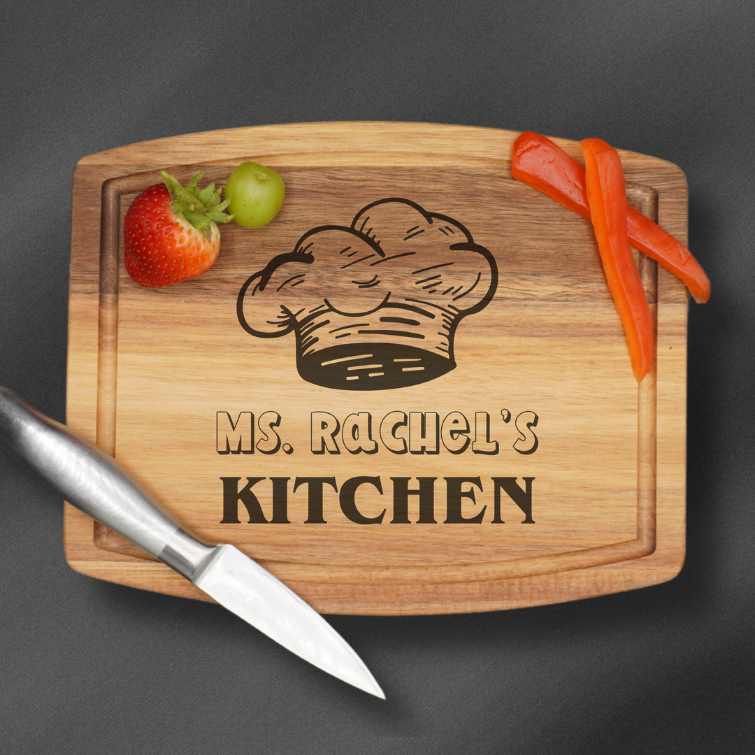 Rectangular cutting board laser engraved with a chefs hat and a name and a juice groove