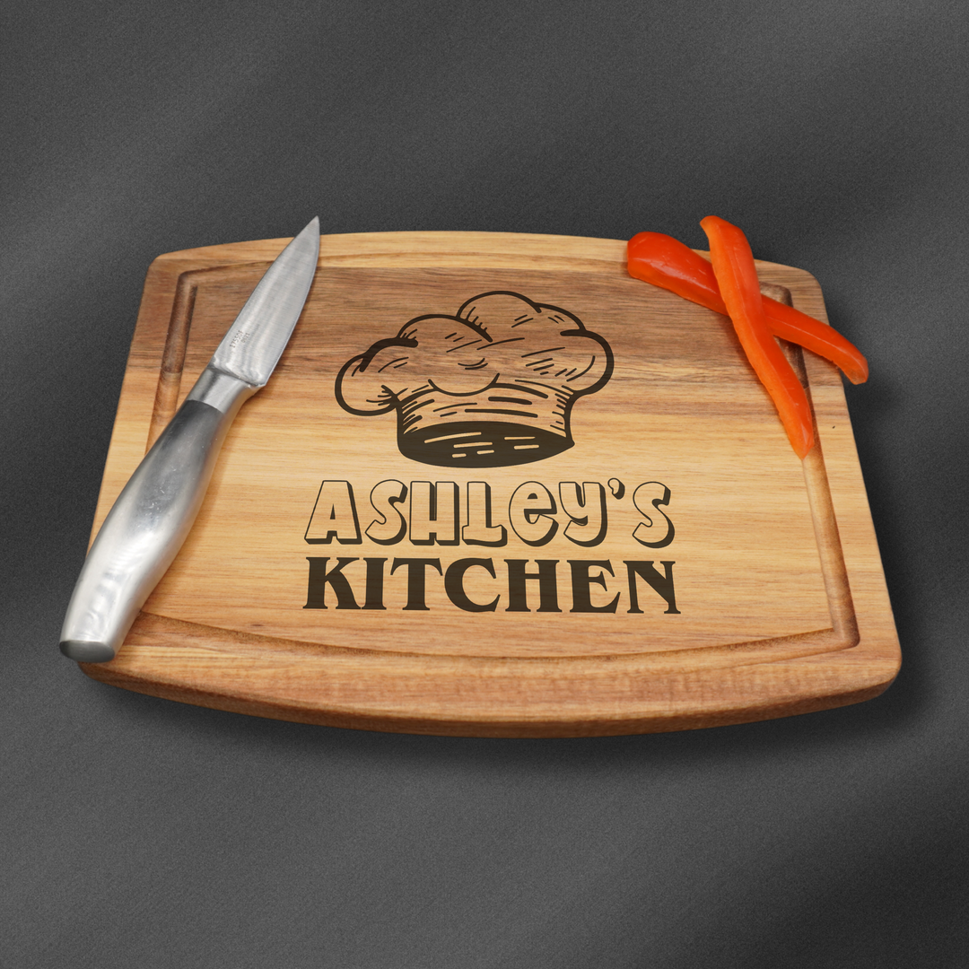 Small rectangular cutting board laser engraved with a name and kitchen design