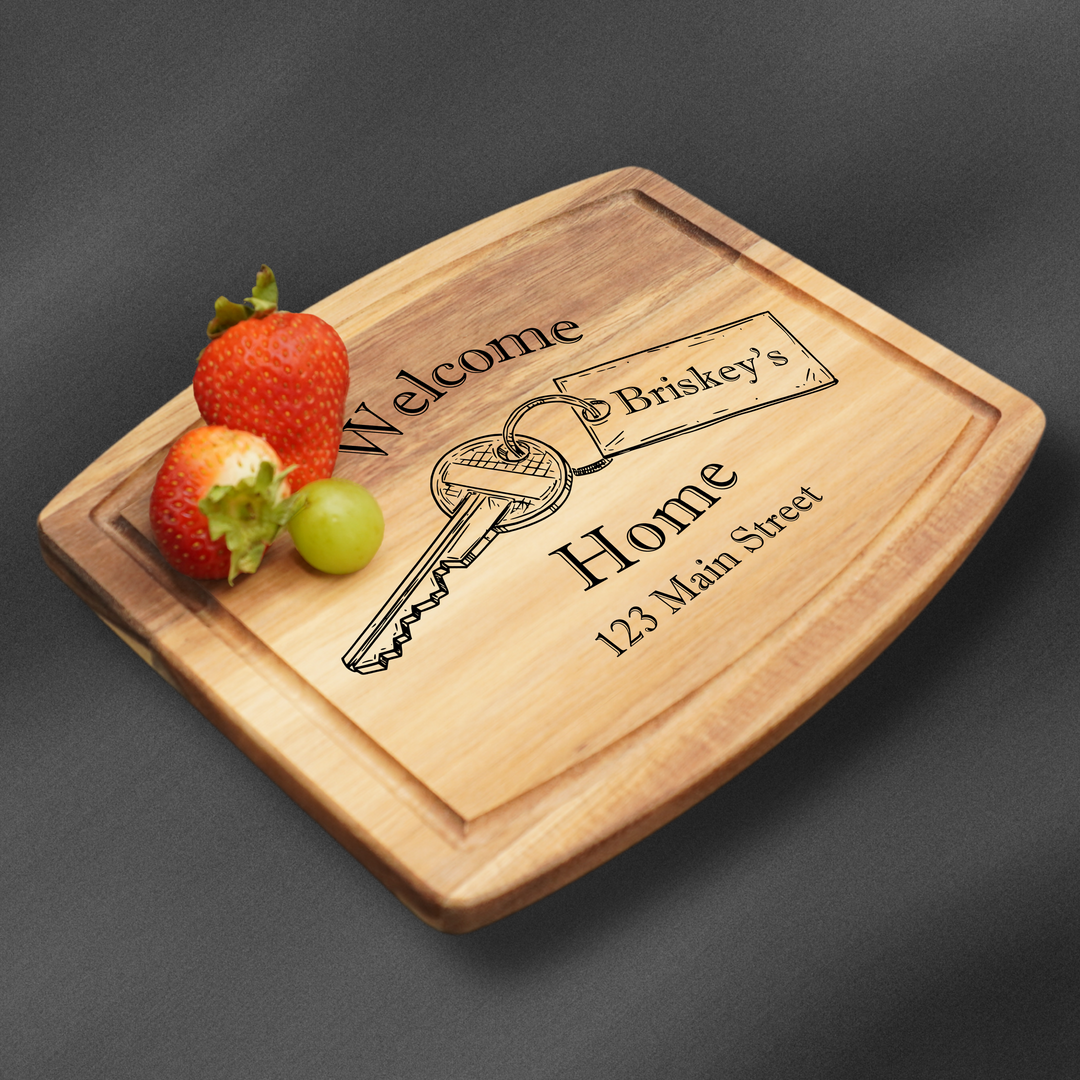Cutting Board personalized with a welcome home engraving and a family name in a rectangle.