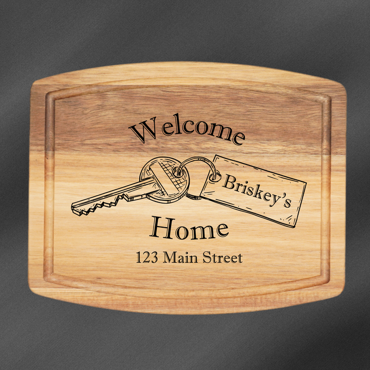 Rectangle Cutting Board personalized with a welcome home engraving and a family name.